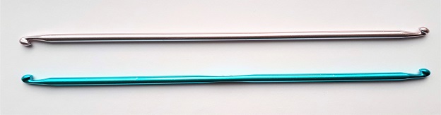 Similar double-ended Tunisian crochet hooks with small differences