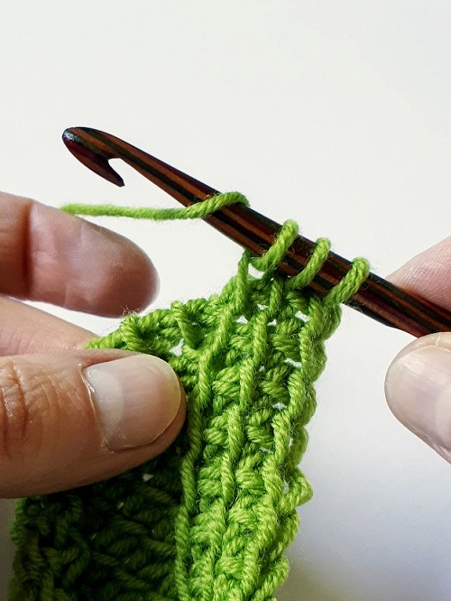 Yarn over increase, add a loop on your hook in between 2 stitches
